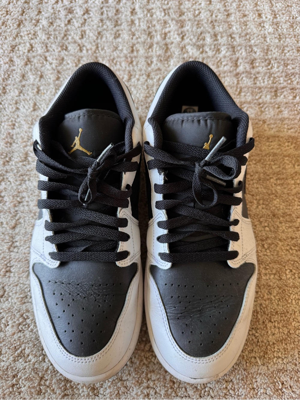 Air Jordan 1 Low in black, white, and metallic gold colorway men’s size 9.5